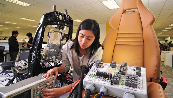 Victoria Penas Senior System Test Engineer testing for seat heating and ventilation, as well as headrest and backrest adjustment.