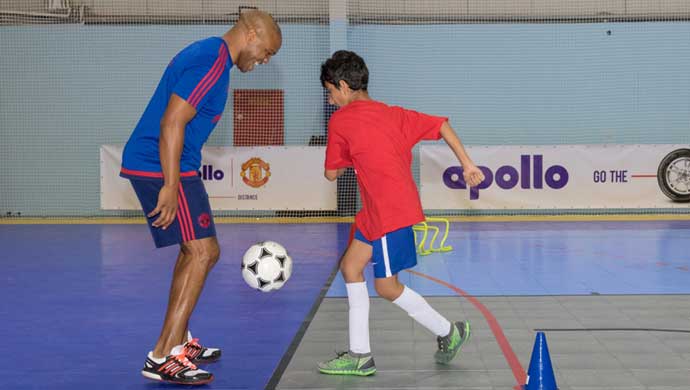 Quinton Fortune in action with a participating kid