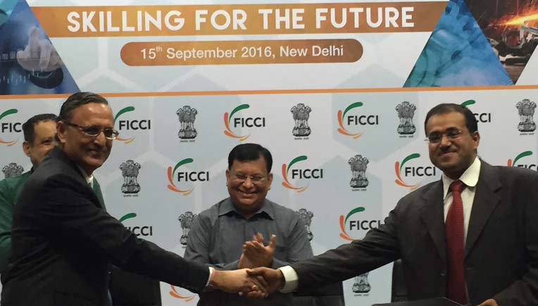 Mahesh Rajoria, Assistant Vice President, Driving Training, MSIL and Amit Jain, President, Uber India exchange the MoU at the 9th Global Skills Summit at FICCI