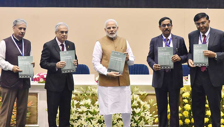Prime Minister Narendra Modi releasing the report 'Transforming India's Mobility: A Perspective'
