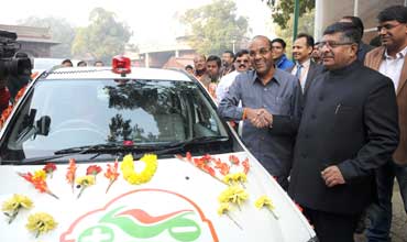 GREEN DAY: Geete takes his new Mahindra electric car to Parliament 
