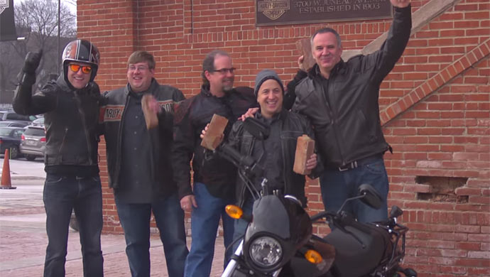 An ecstatic Harley-Davidson team with the bricks for Sturgis