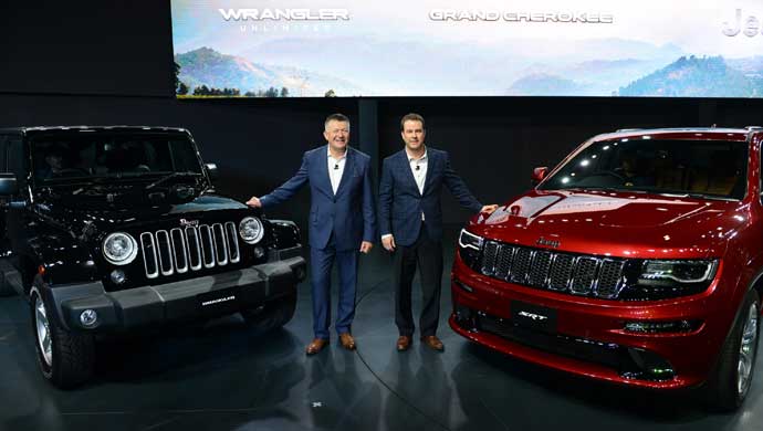 Jim Morrison and Kevin Flynn with the newly unveiled vehicles from Jeep