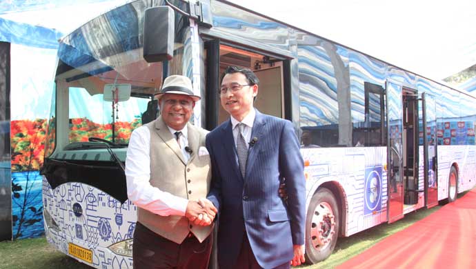 Dr. Bhupendra Kumar Modi with Liu, BYD Company Limited (BYD) during the unveiling of an electric bus  