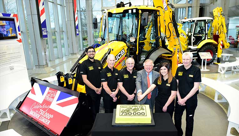 {L-R} JCB backhoe loader employees Nihal Dhillon, Phil Starbuck, John Plant, JCB Chairman Lord Bamford, Shannon Ramczykowski and Keith Bloor