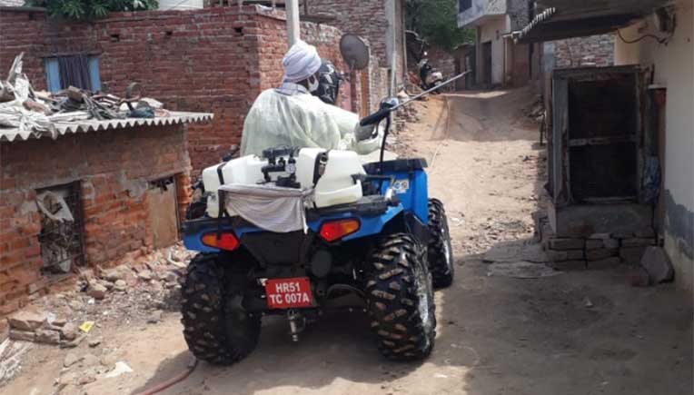Polaris Sportsman 570 tractor gets into sanitisation mode in Haryana villages