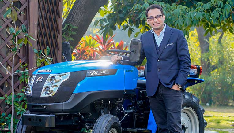 Raman Mittal of Sonalika Group with the new Tiger Electric, India’s 1st field ready electric tractor