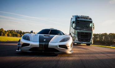 Volvo truck races against a Koenigsegg sports car