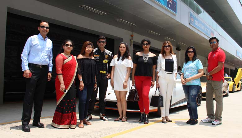 Sporty ladies with the Lamborghini cars and senior officials of the company