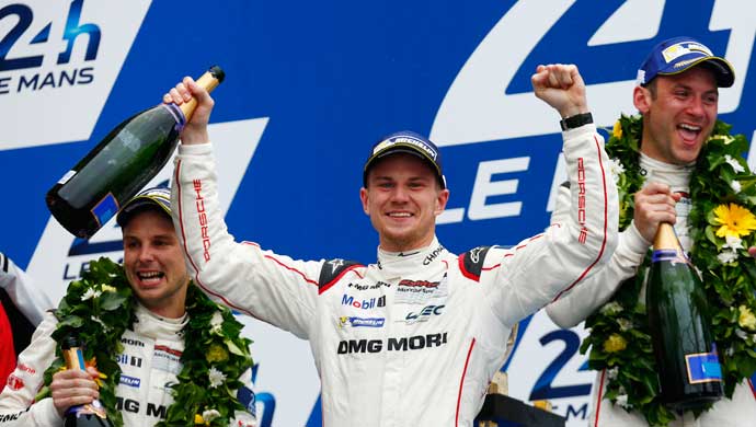 Nico Hulkenberg with Nick Tandy and Earl Bamber on the podium  of the 83rd edition of the 24 hours of Le Mans endurance race