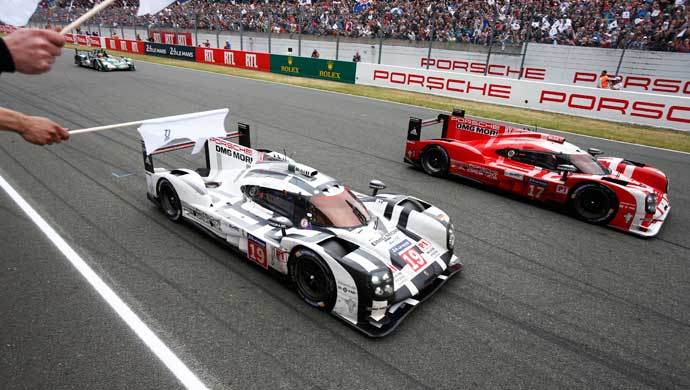 No. 19 and the No.17 Porsche 919 Hybrid LMP1 cars crossing the finish line