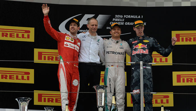 Winners of the Chinese Grand Prix on the podium; Picture courtesy Ferrari